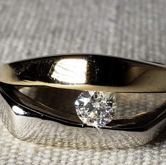 14kt tension set solitaire diamond ring. - Picture 1 of 7